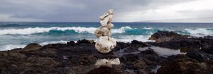 Stones Stacked Up Next to Water